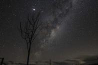 <p>RYLSTONE, AUSTRALIA - MAY 26: The supermoon is seen next to the milky way on May 26, 2021 in Rylstone, Australia. It is the first total lunar eclipse in more than two years, which coincides with a supermoon. A super moon is a name given to a full (or new) moon that occurs when the moon is in perigee - or closest to the earth - and it is the moon's proximity to earth that results in its brighter and bigger appearance. (Photo by Mark Evans/Getty Images)</p> 