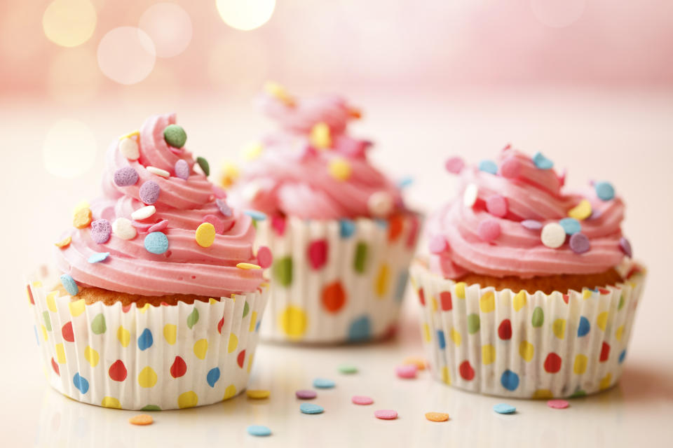Homemade birthday party cupcakes with colorful polka dots.