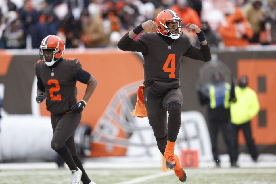 Cleveland Browns quarterback Deshaun Watson (4) reacts after his 12-yard rushing touchdown during the first half of an NFL football game against the New Orleans Saints, Saturday, Dec. 24, 2022, in Cleveland. (AP Photo/Ron Schwane)
