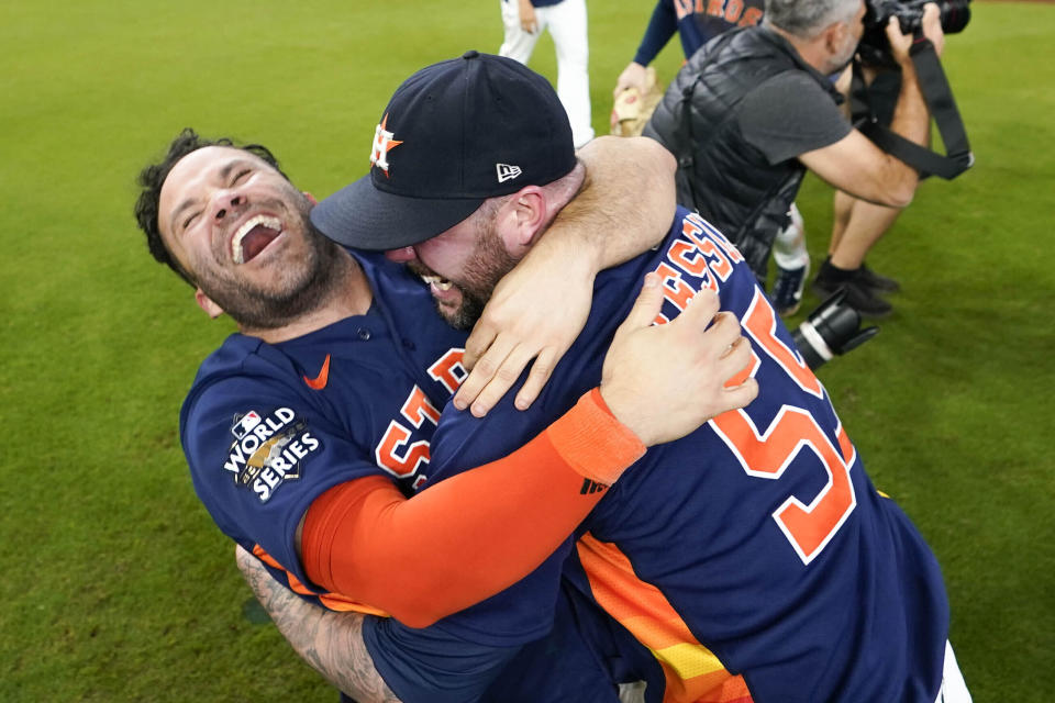 FILE - Houston Astros' Jose Altuve, left, embraces relief pitcher Ryan Pressly as they celebrate their 4-1 World Series win against the Philadelphia Phillies in Game 6, Nov. 5, 2022, in Houston. Altuve and the Astros get another opportunity to celebrate the franchise's second World Series championship when they host Tim Anderson and the Chicago White Sox on opening day Thursday, March 30, 2023. (AP Photo/David J. Phillip, File)