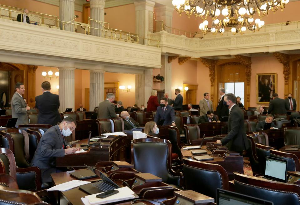 Members of the Ohio House of Representatives mingle before a session.