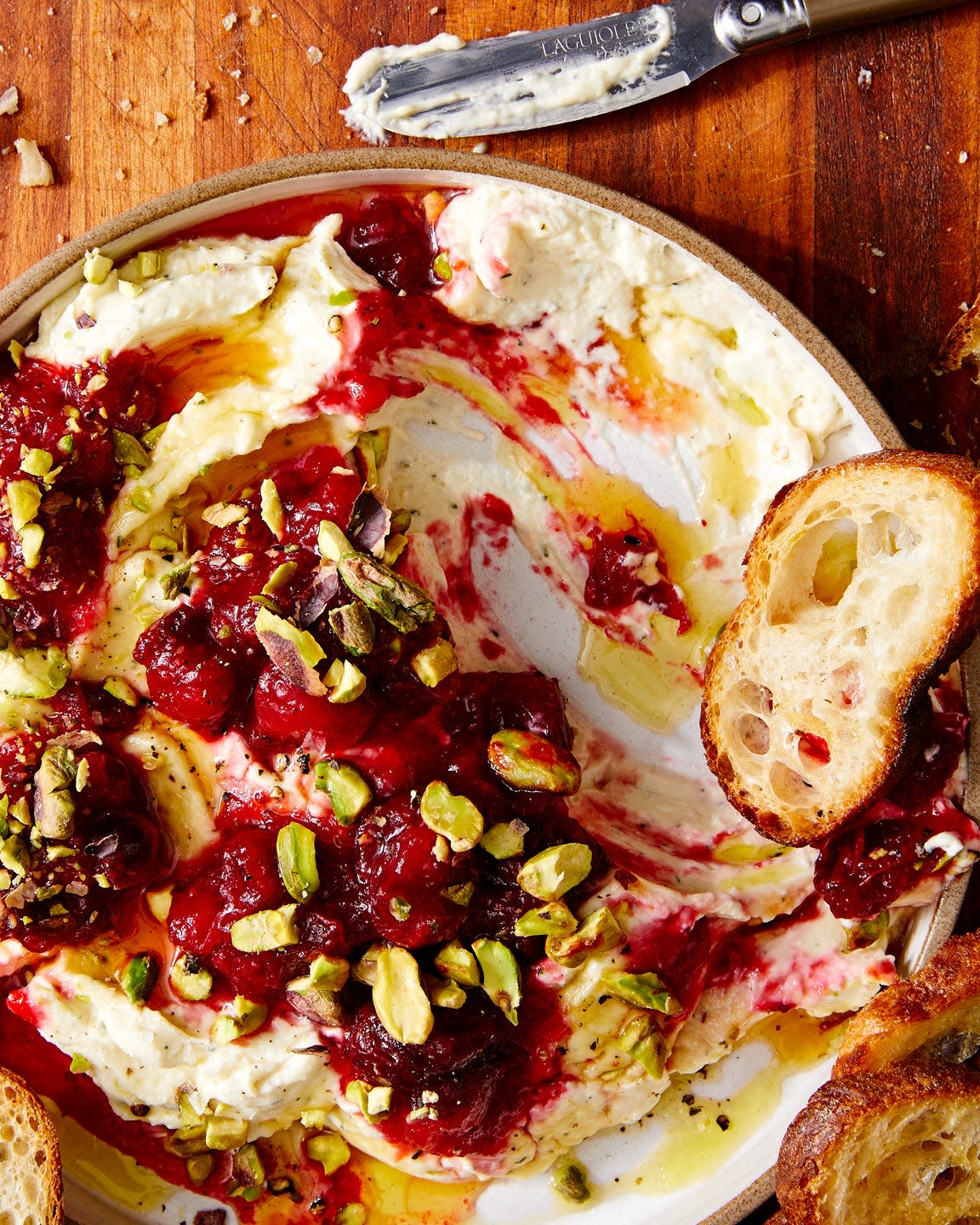 whipped garlic and herb feta, topped with fresh cranberry sauce, pistachios, and honey