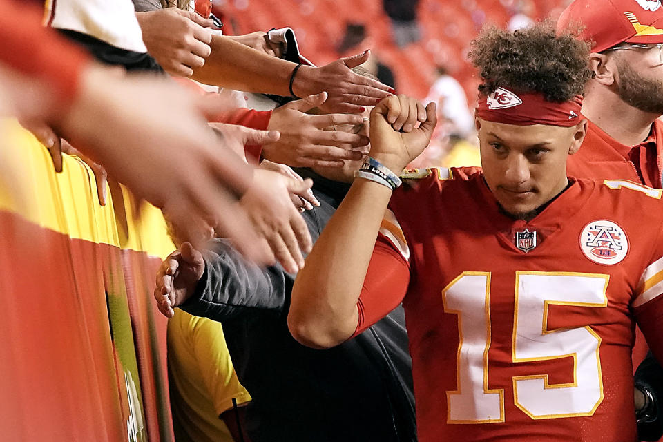 Kansas City Chiefs quarterback Patrick Mahomes (15) greets fans after an NFL football game against the Green Bay Packers Sunday, Nov. 7, 2021, in Kansas City, Mo. Kansas City won 13-7. (AP Photo/Charlie Riedel)