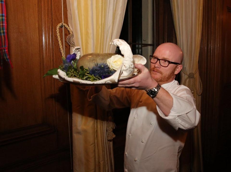 <span class="caption">Both governments and community organizations promote Robert Burns suppers. Here, an official United Kingdom government photo shows the haggis brought in at the British Prime Minister's residence, Jan. 22, 2018. </span> <span class="attribution"><span class="source">(Number 10/Flickr)</span></span>