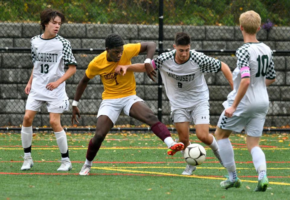 Doherty's Jevin Green battles for the ball with Wachusett's John Krikonis.