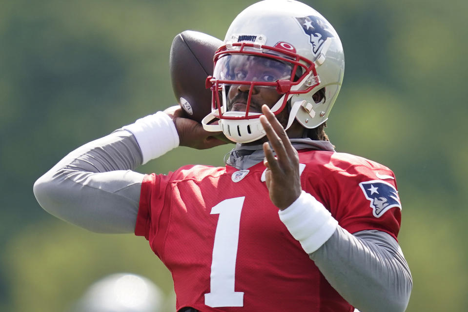 New England Patriots quarterback Cam Newton throws a pass during an NFL football practice, Friday, July 30, 2021, in Foxborough, Mass. (AP Photo/Elise Amendola)