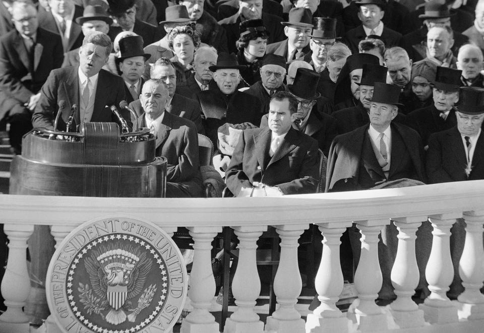 President John F. Kennedy gives his inaugural address Jan. 20, 1961, at the Capitol in Washington after taking the oath of office. In the front row, from left, are incoming Vice President Lyndon Johnson; outgoing Vice President Richard Nixon, whom Kennedy defeated in the election; Sen. John Sparkman, D-Ala.; and former President Harry Truman.