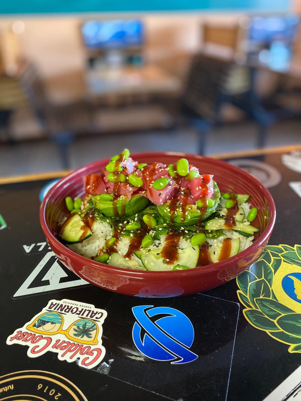 The ahi tuna stuffed avocado at Mel's Tiki Cafe in Indialantic is made from a whole avocado, grilled and topped with fresh ahi tuna, sesame seeds, green onion, poke sauce and sriracha aioli.