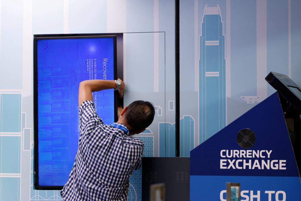 A screen showing an error is seen at a currency exchange store at Hong Kong International Airport amid system outages disrupting the operations, in Hong Kong, on July 19, 2024.