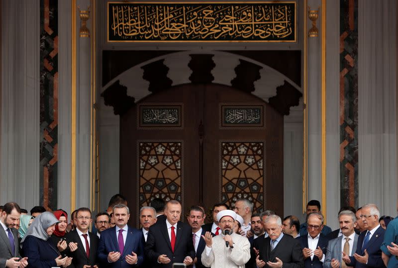 FILE PHOTO: Turkish President Erdogan prays during the opening ceremony of a mosque in Istanbul