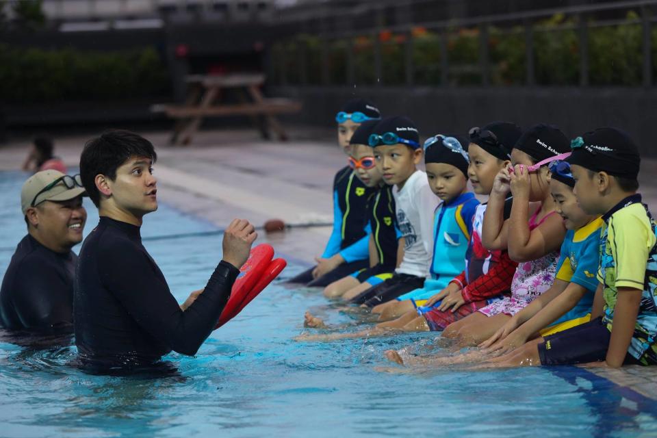 Joseph Schooling (second from left) at the launch of Swim Schooling at Our Tampines Hub on Wednesday (27 June 2018). (Photo: Swim Schooling/Facebook)