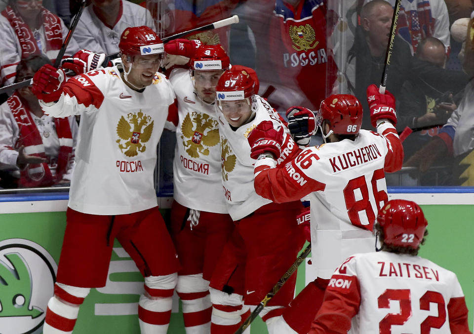 Russia players celebrate after scoring during the Ice Hockey World Championships group B match between Switzerland and Russia at the Ondrej Nepela Arena in Bratislava, Slovakia, Sunday, May 19, 2019. (AP Photo/Ronald Zak)