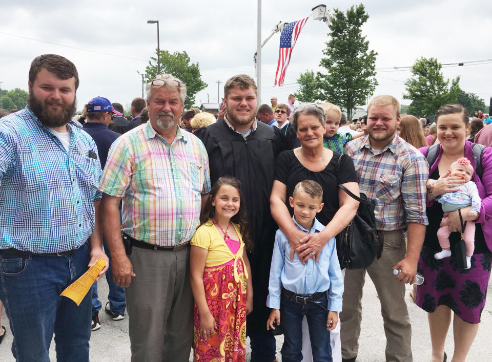 Image:; Kim Johnson and her family at the high school graduation of her son Sam in May 2017 (Courtesy Kim Johnson)