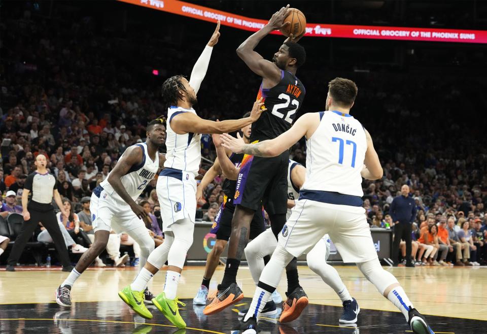 May 15, 2022; Phoenix, Arizona, USA; Phoenix Suns center Deandre Ayton (22) looks to the basket against Dallas Mavericks guard Jalen Brunson (13) during game seven of the second round for the 2022 NBA playoffs at Footprint Center.