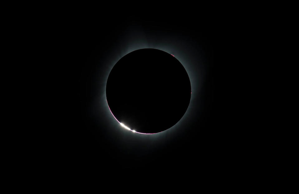 The Bailey's Beads effect is seen as the moon makes its final move over the sun during the total solar eclipse on Monday, August 21, 2017 above Madras, Oregon.  (Aubrey Gemignani / NASA)