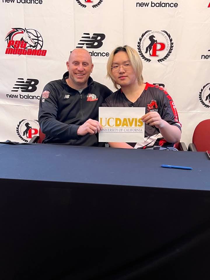 Putnam Science Academy Athletic Director Tom Espinosa with Senior Peter Chen, who signed to University of California Davis to play on their esports team.
