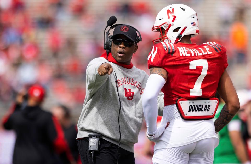 FILE - Then-Nebraska associate head coach and wide receivers/passing game coordinator Mickey Joseph chats with red team wide receiver Latrell Neville (7) during the second half of Nebraska's NCAA college football annual red-white spring game at Memorial Stadium in Lincoln, Neb., Saturday, April 9, 2022. Mickey Joseph begins his run as Nebraska's interim head coach following Scott Frost's firing. (AP Photo/Rebecca S. Gratz, File)