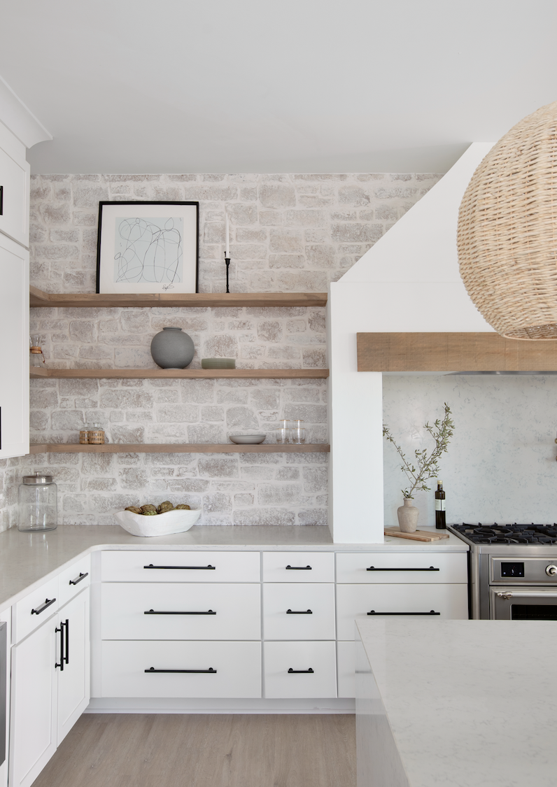 a kitchen with white cabinets