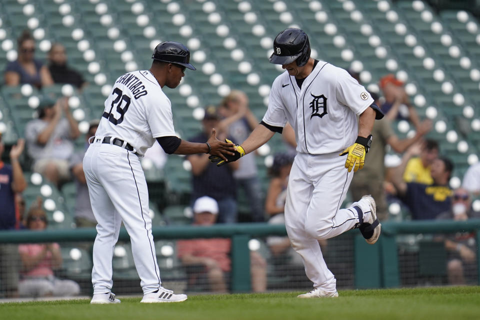 Detroit Tigers' Dustin Garneau hits a solo home run against the Milwaukee Brewers in the seventh inning of a baseball game in Detroit, Wednesday, Sept. 15, 2021. (AP Photo/Paul Sancya)