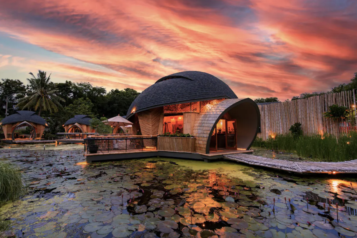 Houseboat Turtle Bay Villa on pond with sunset sky