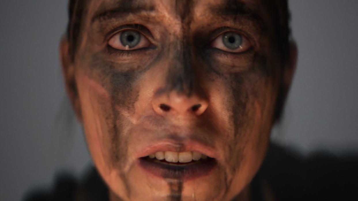  A close up of Senua's face in Senua's Saga: Hellblade 2. 