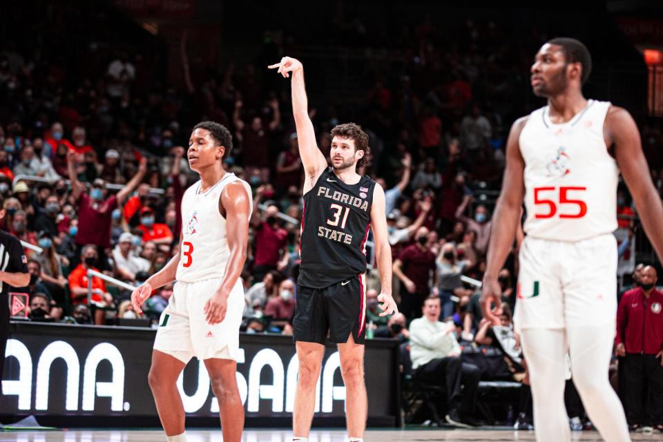 Florida State forward Wyatt Wilkes hits a three-pointer at the buzzer of the first half in the Seminoles' 61-60 road win at Miami on Jan. 22, 2022.