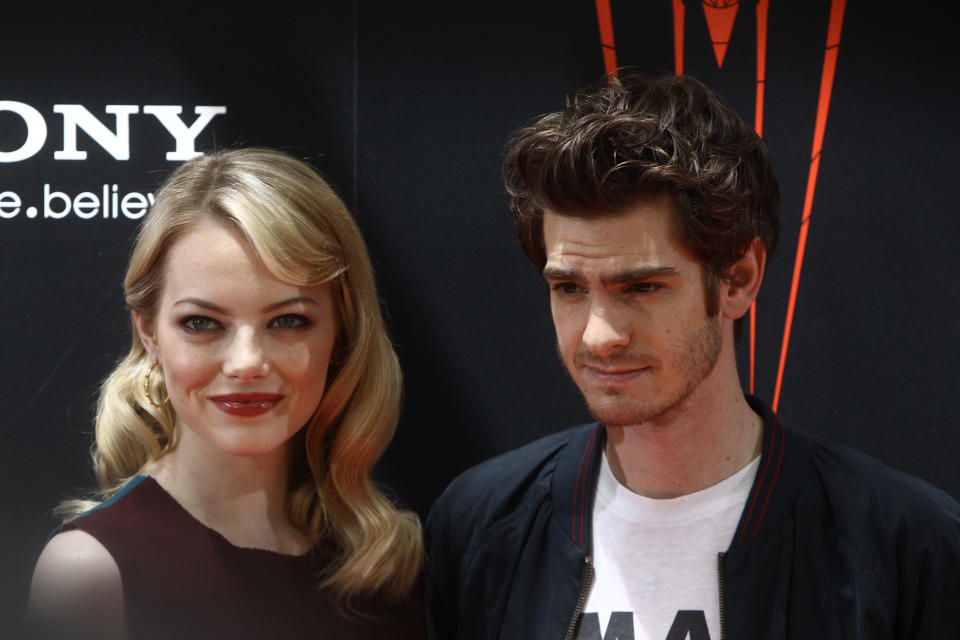 Emma Stone and Andrew Garfield attend a photocall for "The Amazing Spider-Man" in 2012.