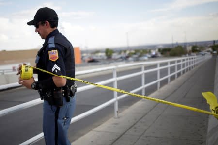 A police cordon is seen after a mass shooting at a Walmart in El Paso