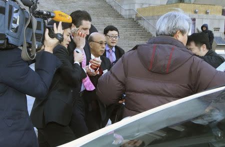 U.S. Ambassador to South Korea Mark Lippert (3rd L) leaves after he was slashed in the face by an unidentified assailant at a public forum in central Seoul March 5, 2015. REUTERS/Yonhap