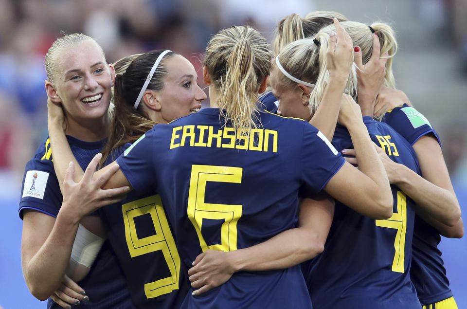 Sweden's Stina Blackstenius, left, with teammates celebrates after scoring her side's second goal during the of the Women's World Cup quarterfinal soccer match between Germany and Sweden at Roazhon Park in Rennes, France, Saturday, June 29, 2019. (AP Photo/David Vincent)