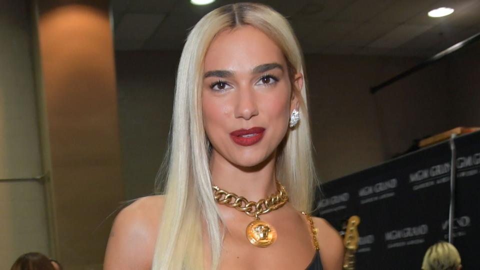 dua lipa blonde hair red lips