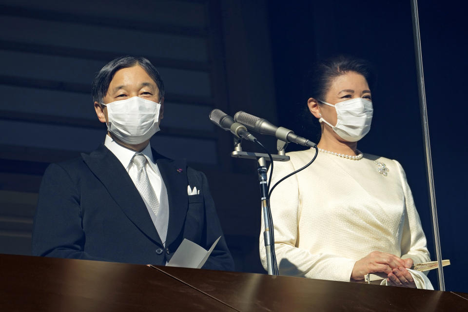 Japan's Emperor Naruhito delivers a speech with Empress Masako to well-wishers from the bullet-proofed balcony during a public appearance with his imperial families at Imperial Palace in Tokyo, Monday, Jan. 2, 2023. (AP Photo/Shuji Kajiyama, Pool)