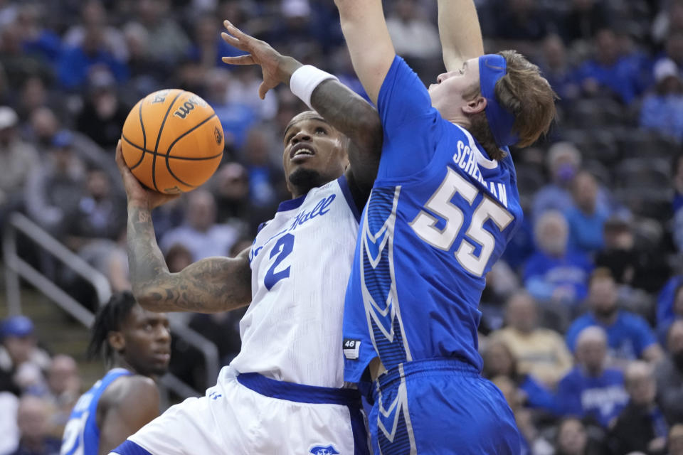 Seton Hall guard Al-Amir Dawes (2) goes to the basket against Creighton guard Baylor Scheierman (55) during the second half of an NCAA college basketball game, Wednesday, Feb. 8, 2023, in Newark, N.J. Creighton won 75-62. (AP Photo/Mary Altaffer)