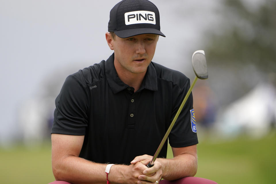 Mackenzie Hughes, of Canada, lines up his shot on the second green during the third round of the U.S. Open Golf Championship, Saturday, June 19, 2021, at Torrey Pines Golf Course in San Diego. (AP Photo/Jae C. Hong)