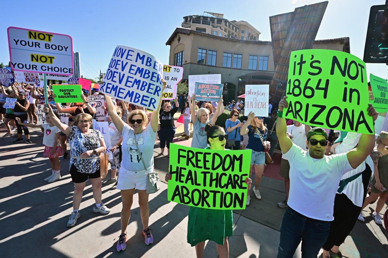 Pro-abortion rights demonstrators rally in Scottsdale, Ariz., on April 15, 2024. <a href="https://www.gettyimages.com/detail/news-photo/pro-abortion-rights-demonstrators-rally-in-scottsdale-news-photo/2147816100?adppopup=true" rel="nofollow noopener" target="_blank" data-ylk="slk:Frederic J. Brown/AFP via Getty Images;elm:context_link;itc:0;sec:content-canvas" class="link ">Frederic J. Brown/AFP via Getty Images </a>