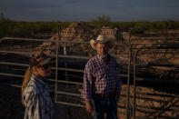 Ranchers survey pit collecting produced water from well blowout in Pecos County, Texas