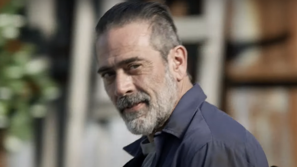 Negan smirking at Maggie in The Walking Dead.