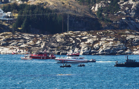 Rescuers work at a site where a helicopter has crashed, west of the Norwegian city of Bergen April 29, 2016. NTB Scanpix/Marit Hommedal/via REUTERS