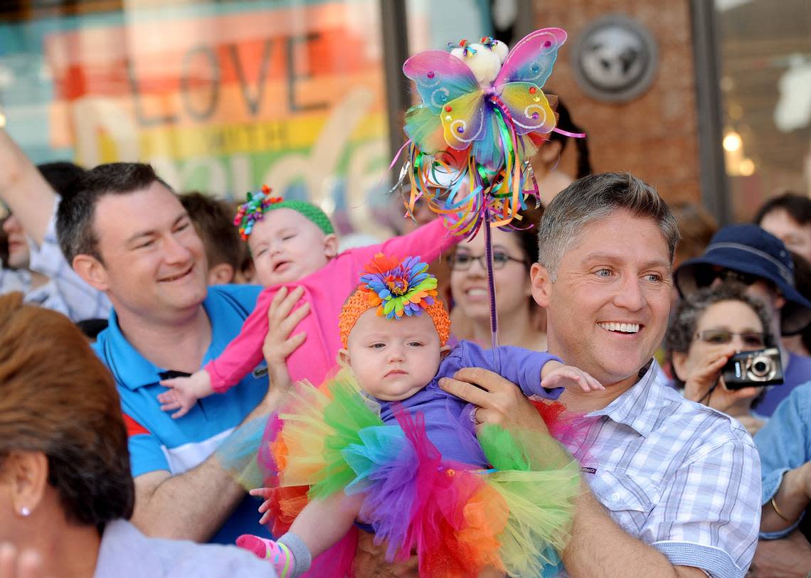 In 2013, Timothy Stephenson, right, and his husband, Jospeh Ginejko, held their 6-month-old twin daughters while watching San Francisco’s Gay Pride parade. Stephenson was charged earlier this year with second-degree murder.