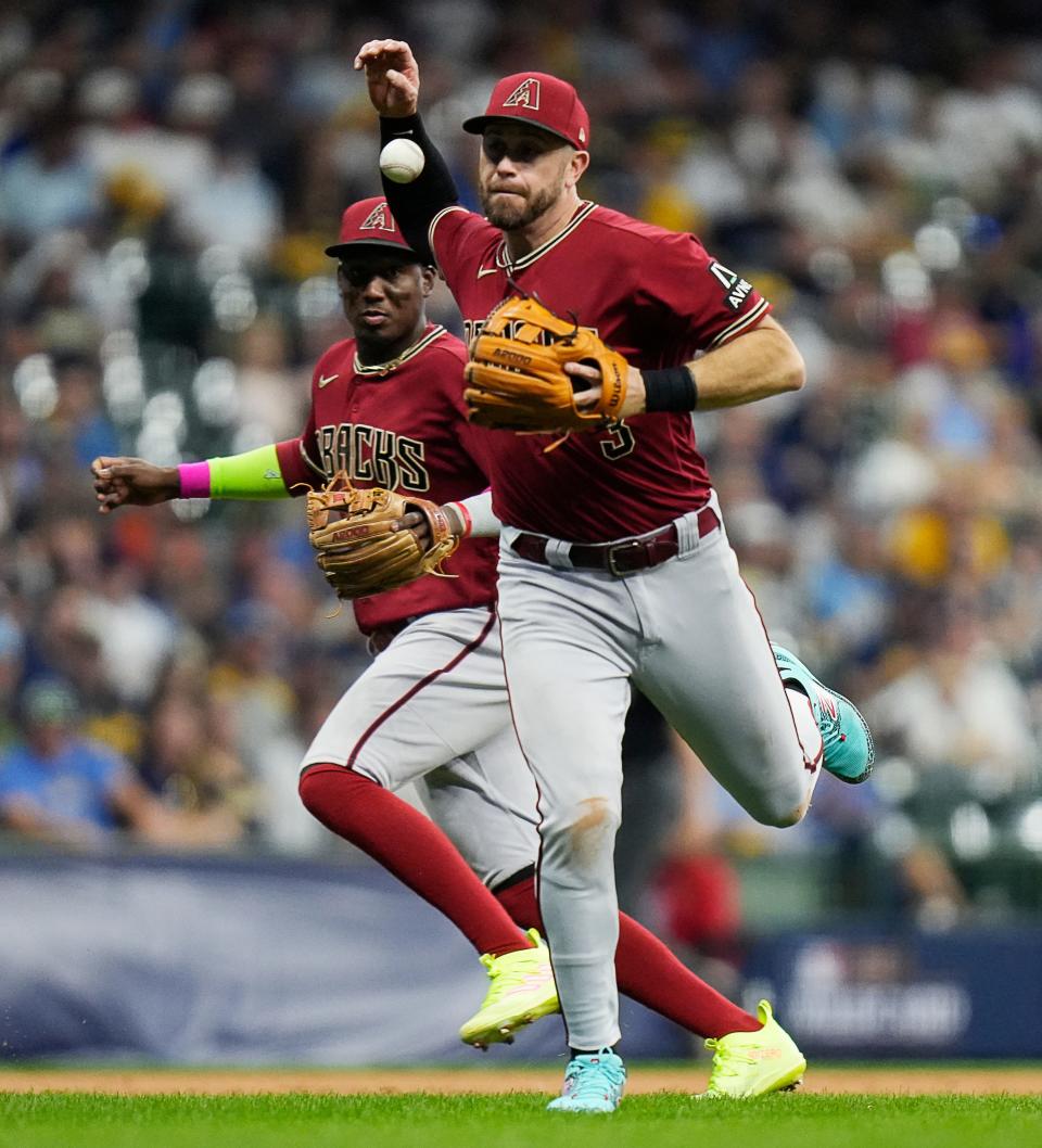 Arizona Diamondbacks third baseman Evan Longoria (3) takes out Milwaukee Brewers left fielder Christian Yelich (22) during the sixth inning of the wildcard playoff game on Tuesday October 3, 2023 at American Family Field in Milwaukee, Wis.