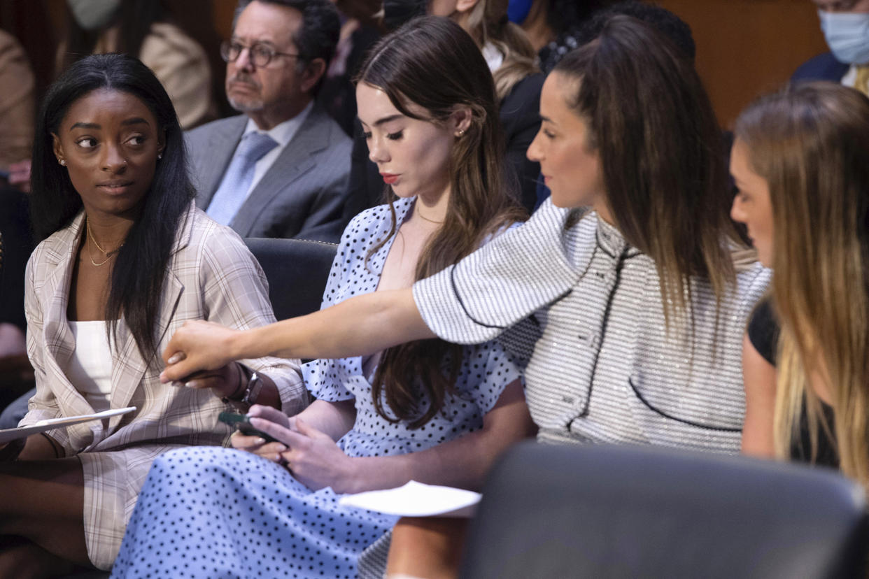 U.S. gymnasts from left, Simone Biles, McKayla Maroney, Aly Raisman and Maggie Nichols, arrive to testify during a Senate Judiciary hearing about the Inspector General's report on the FBI's handling of the Larry Nassar investigation on Capitol Hill, on Sept. 15, 2021. (Saul Loeb / Pool via AP)