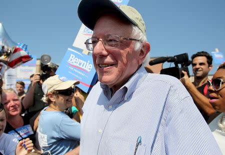 U.S. Democratic presidential candidate and U.S. Senator Bernie Sanders pauses to talk to the media before the start of the Milford Labor Day Parade in Milford, New Hampshire September 7, 2015. REUTERS/Mary Schwalm