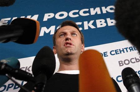 Opposition leader Alexei Navalny speaks to the media at his campaign headquarters after voting closed in a mayoral election in Moscow September 8, 2013. REUTERS/Maxim Shemetov