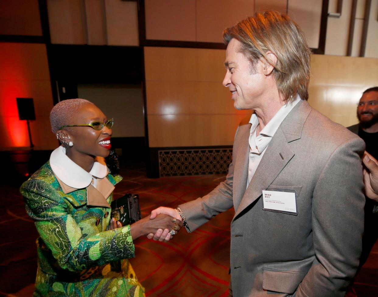 Brad Pitt shaking hands with Cynthia Erivo at the Oscars lunch in LA, Monday 27 January 2020: Danny Moloshok/Invision/AP