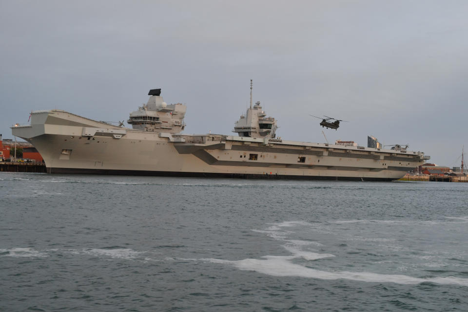 A Chinook takes off from HMS Queen Elizabeth.