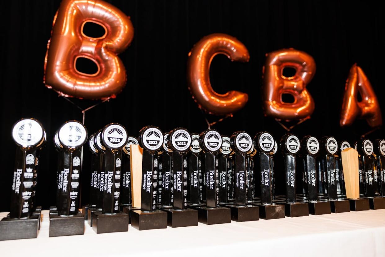 A row of awards awaiting presentation at the 2022 ceremony. Just under 100 individual beer awards were presented in 2023. (B.C. Beer Awards - image credit)