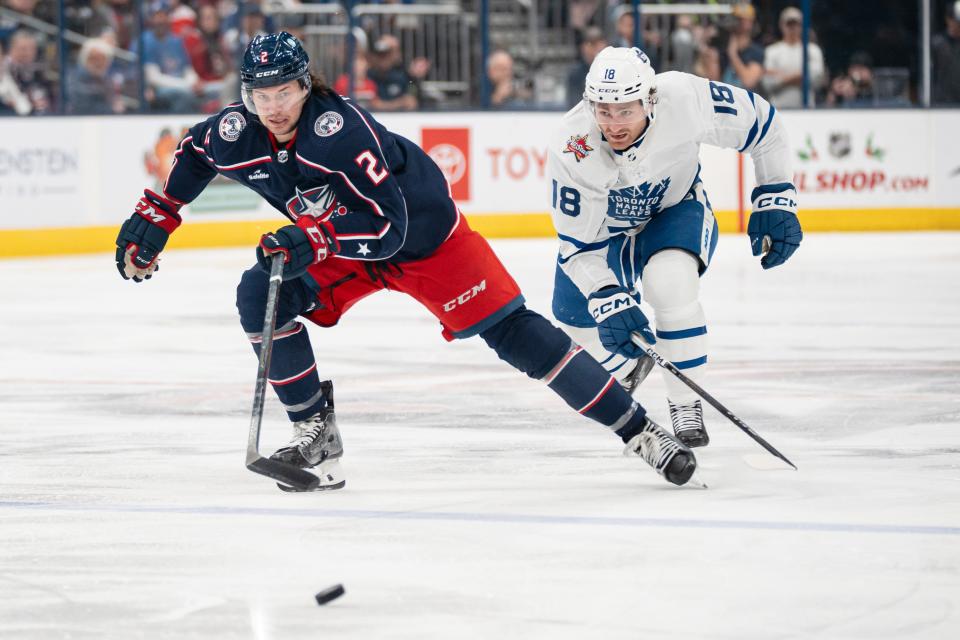 Dec 23, 2023; Columbus, Ohio, USA;
Columbus Blue Jackets defenseman Andrew Peeke (2) races Toronto Maple Leafs center Noah Gregor (18) to the puck during the second period of their game on Saturday, Dec. 23, 2023 at Nationwide Arena.