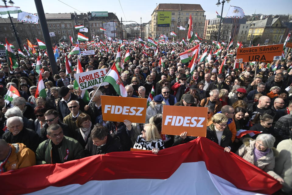 Participants of the Peace March walk during a demonstration organized by the pro-government Civic Solidarity Forum Foundation to express support for the current Hungarian government with regard to the upcoming general elections in April in Budapest, Hungary, Tuesday, March 15, 2022, coinciding with the national holiday marking the 174th anniversary of the outbreak of the 1848 revolution and war of independence against the Habsburg rule. (Zoltan Balogh/MTI via AP)