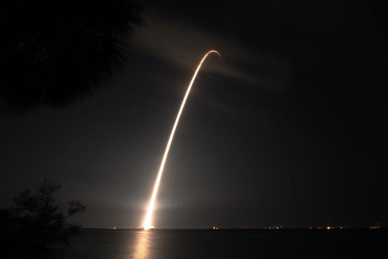A time exposure captures the streak of the Falcon 9 rocket as it climbs away from Cape Canaveral. / Credit: William Harwood/CBS News