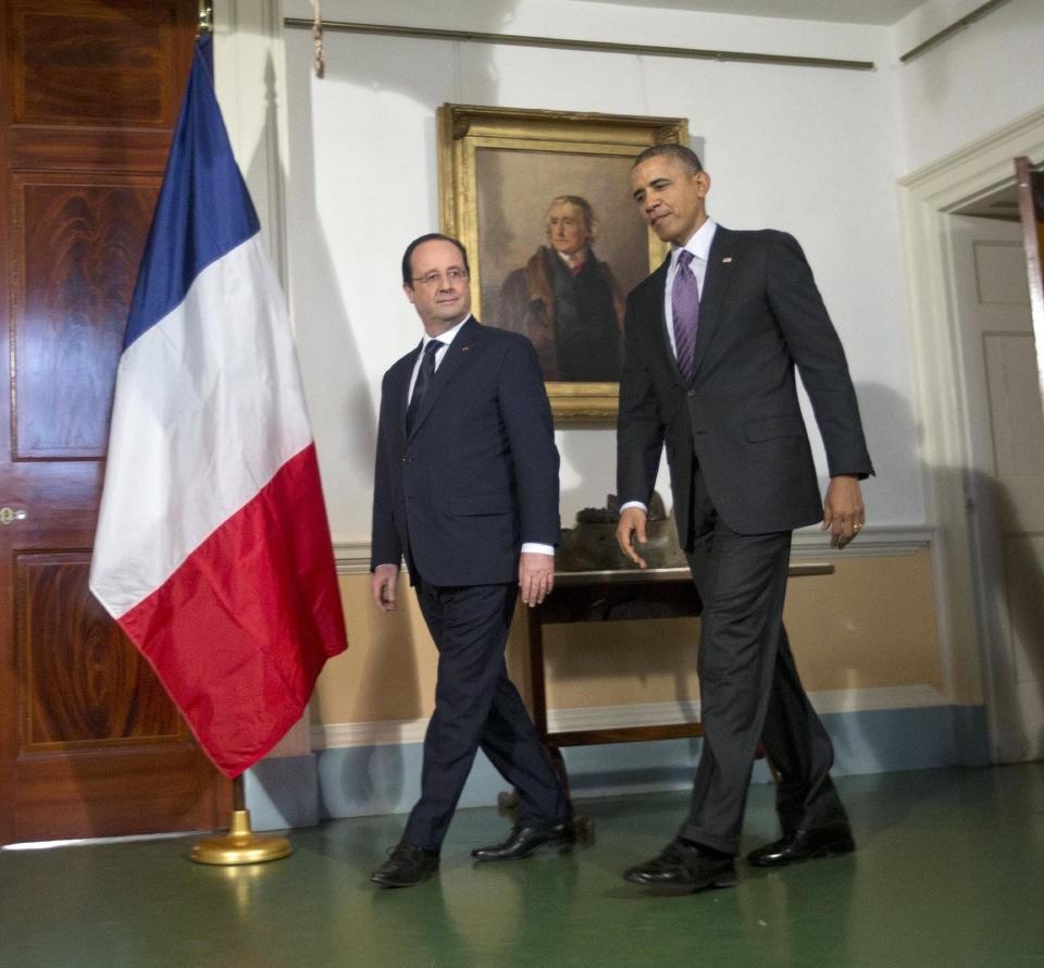 President Barack Obama, right, and French President Francois Hollande, left, walk in before speaking to members of the media following their tour of Monticello, President Thomas Jefferson’s estate, Monday, Feb. 10, 2014, in Charlottesville, Va. (AP Photo/Pablo Martinez Monsivais)